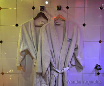 Complimentary robes hang in a Buenos Aires Telo