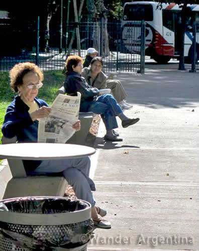 Women sitting on benches in Plaza Almagro