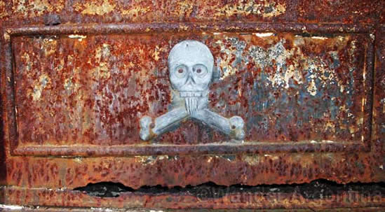A skull on a rusted tomb door in Recoleta cemetery