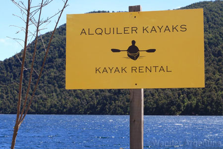 A sign advertising kayak rental on Lake Nahuel Huapi in Patagonia, Argentina