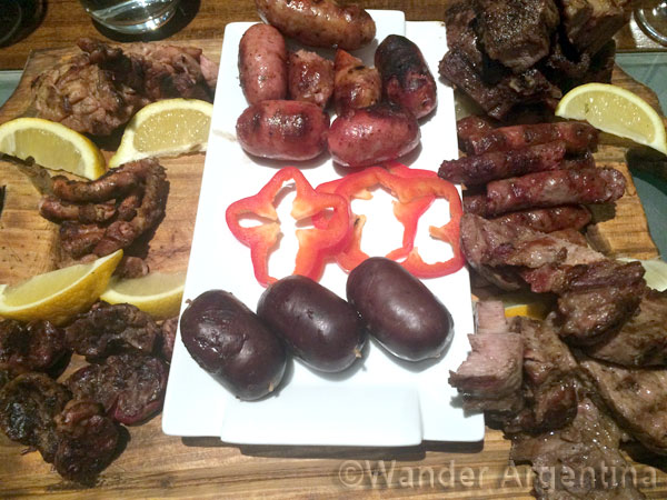 Argentine Parilla appetizers including sausage and blood sausage and achuras, or organ meats