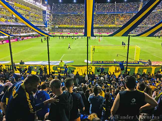 Football fans watch the game in the club member section at La Boca Jrs. Bombonera stadium in the La Boca neighborhood of Buenos Aires