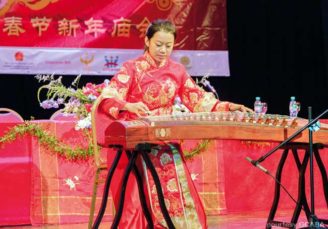 A woman gives a musical performance onstage at Buenos Aires Chinese New Year Celebration