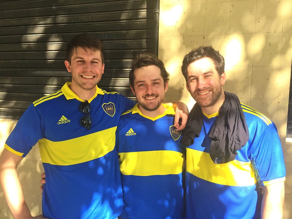 Boca Jrs. fans pose before a game