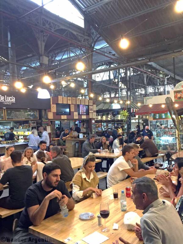 People dining in an open area in the San Telmo Market 