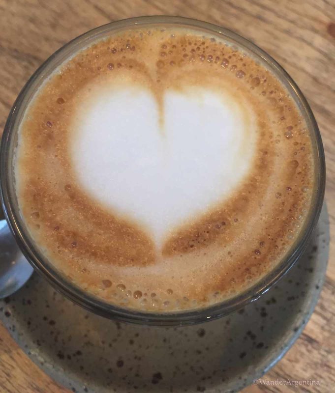 A cup of coffee with foam heart