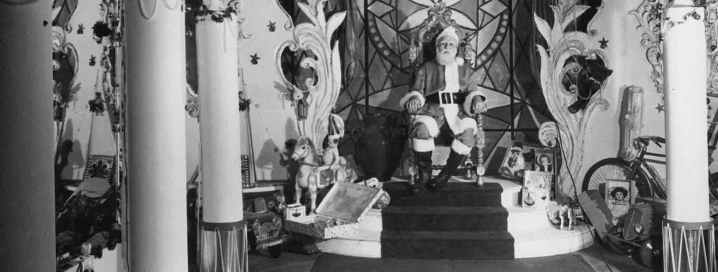 Santa Claus waits for children at Harrods Buenos Aires (black and white archival photo) 