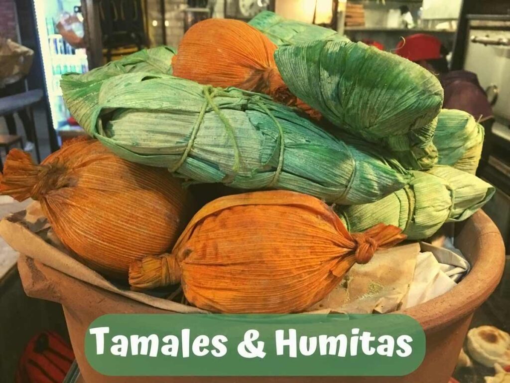 A display of tamales and humitas. 