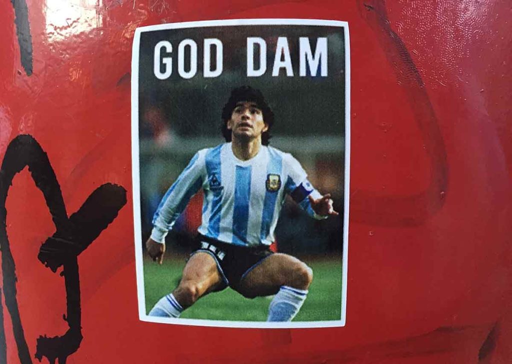 Diego Maradona in the 1986 World Cup, as shown in a sticker on the streets of Buenos Aires